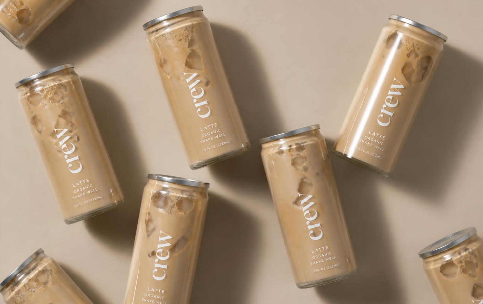 crew cans scattered on a warm beige backdrop